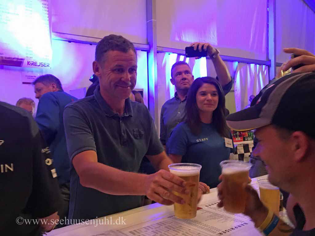 Tom Kristensen serving beer from the bar in K-camp